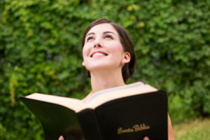 Smiling young woman reflecting