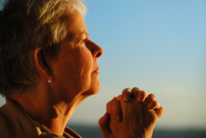 senior woman praying